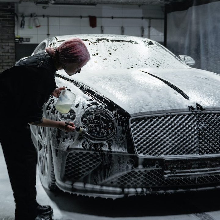 girl washing vehicle